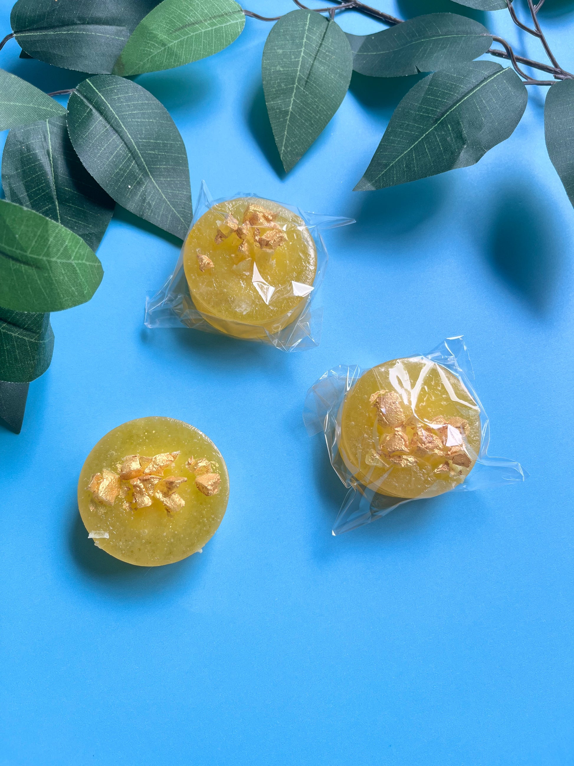 Close-up of hand-painted gold detail on candy surface
