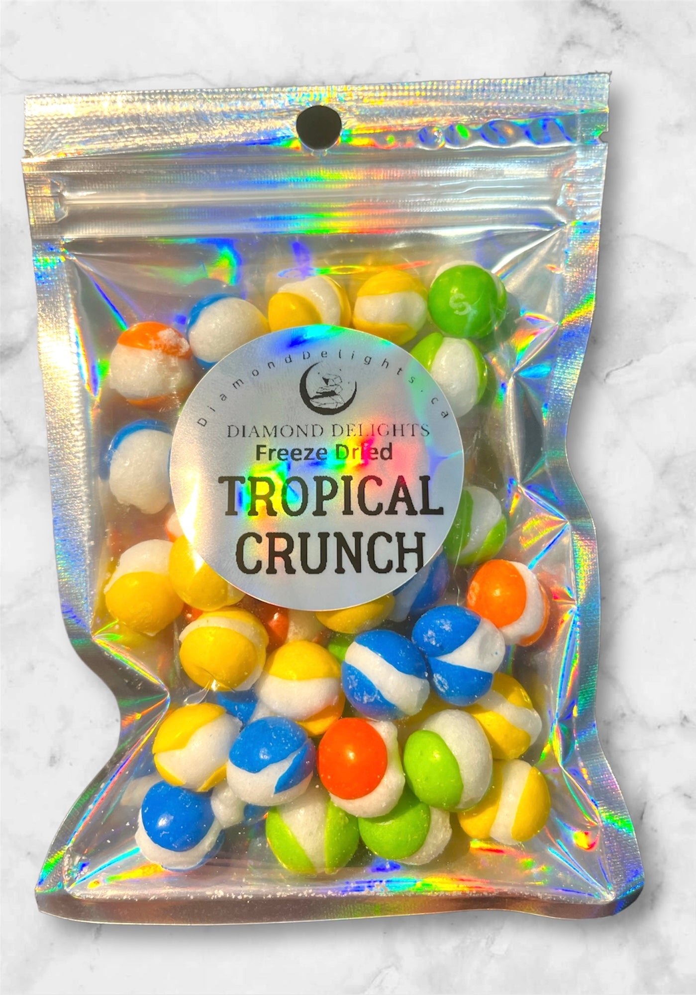 Freeze-dried tropical rainbow candy mix in clear bag with colorful packaging