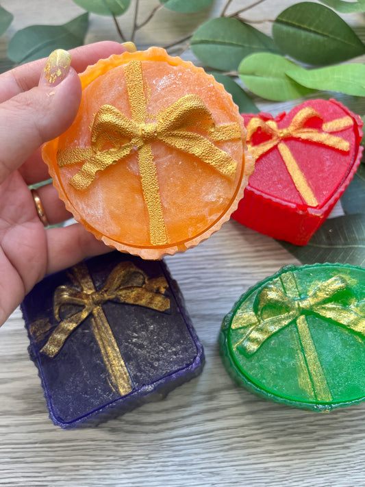 Edible yellow crystal candy box with red bow, filled with assorted candy gems