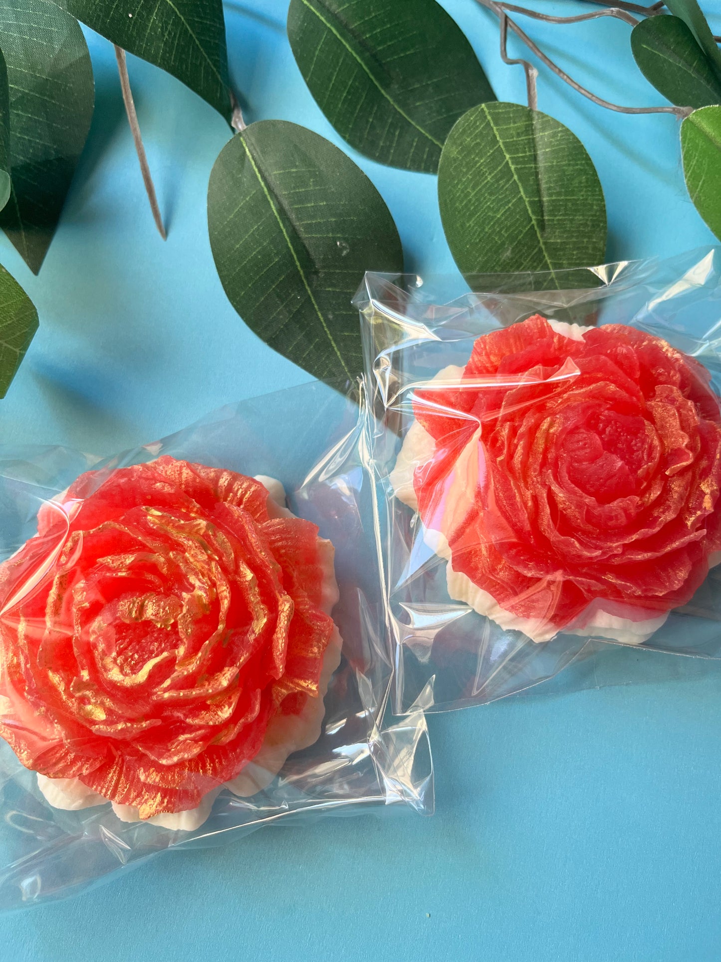Crystal candy flower shaped like a rose in Fruit Loops and Sweet Milk flavor, wrapped in clear packaging.