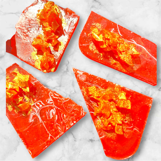 Crunchy red galaxy candy gems with gold shimmer