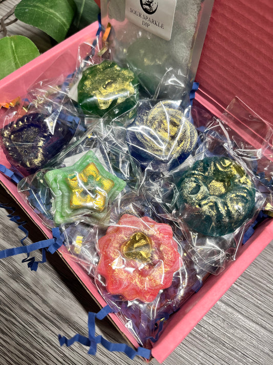 Top-down view of Gushers Crystal Candy Box with colorful assorted candies in gift packaging.