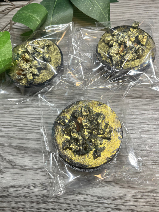 Dubai gold crystal candy with amaretto shell, pistachio filling, and gold dust