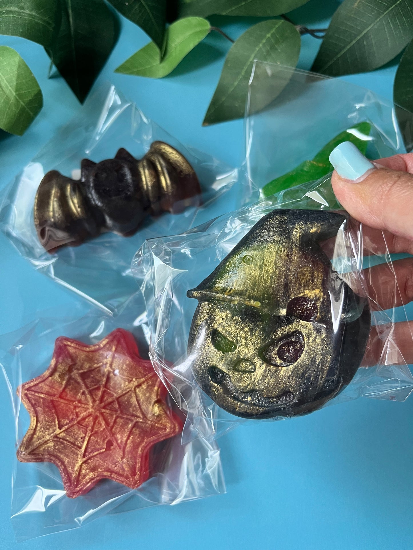 Shimmering black crystal candy bat stuffed with caramel banana bubs, wrapped for Halloween.