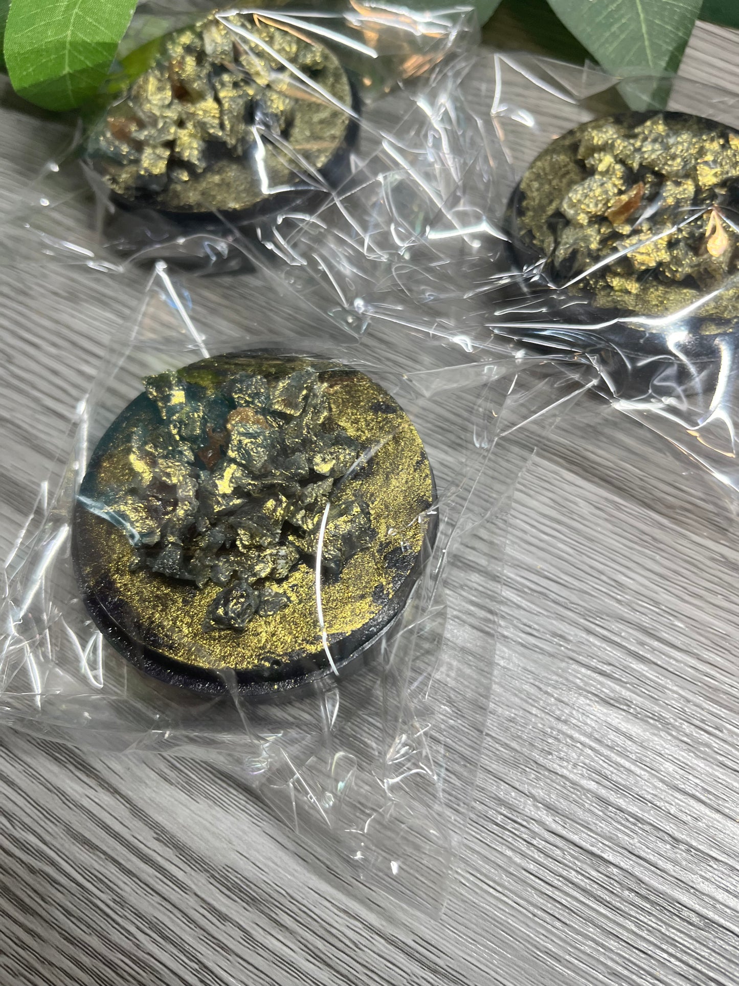 Handmade crystal candies topped with black shards and edible gold flakes