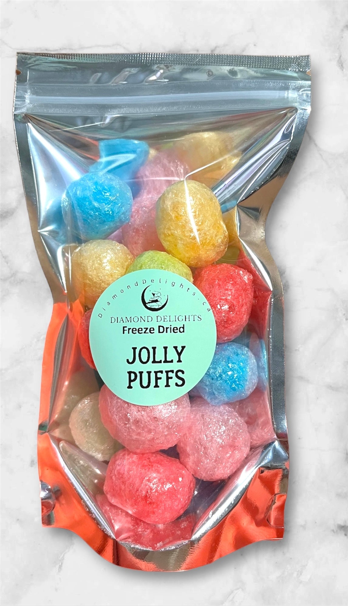Front of bag with colorful freeze dried jolly puffs in a bright, clear pouch