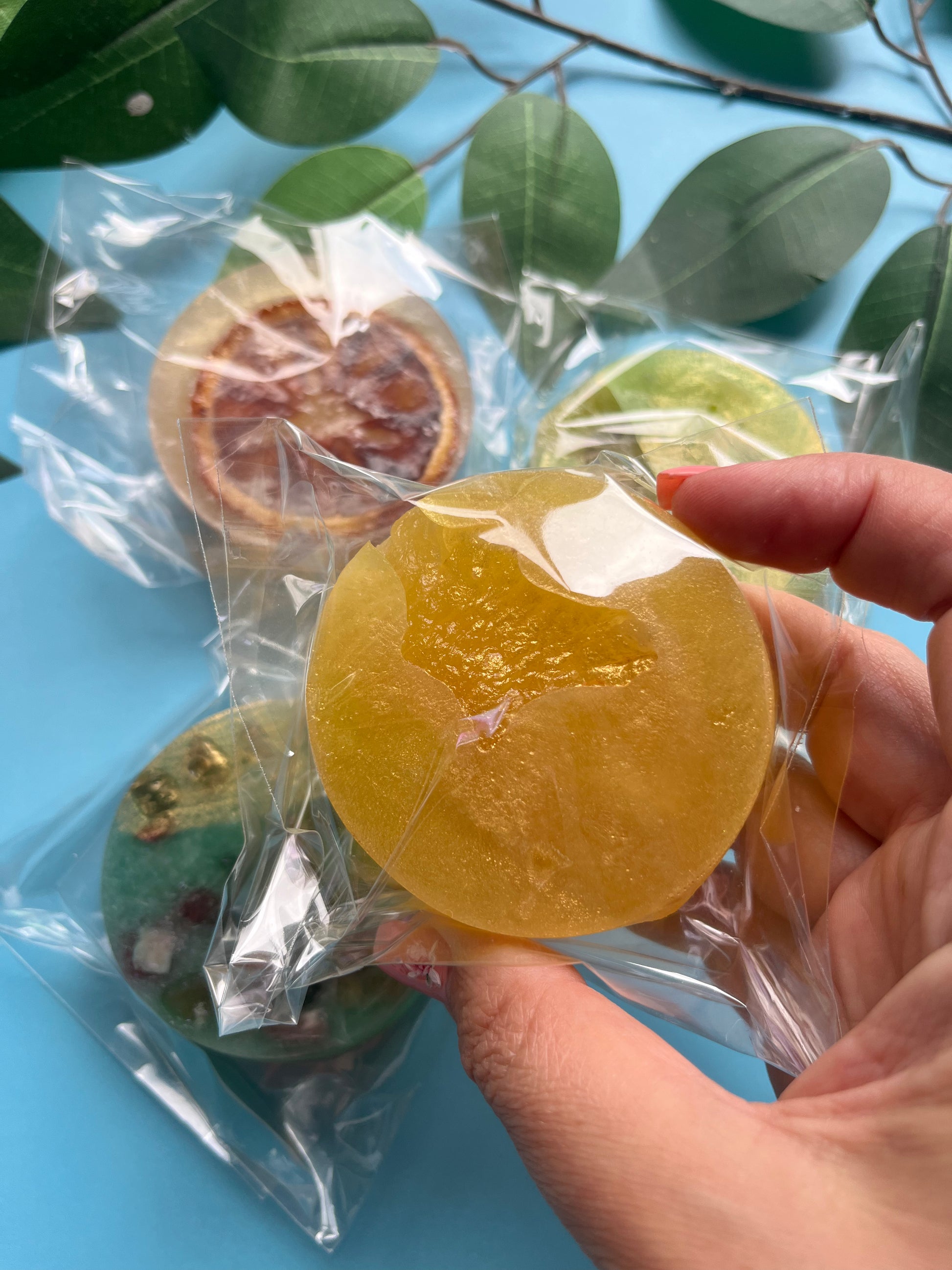 Tropical pineapple candy with a thick, glossy shell and a slice of dried pineapple nestled in the center.