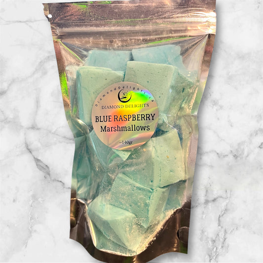 Bright blue fluffy marshmallows in a resealable bag, placed on a marble surface for contrast.