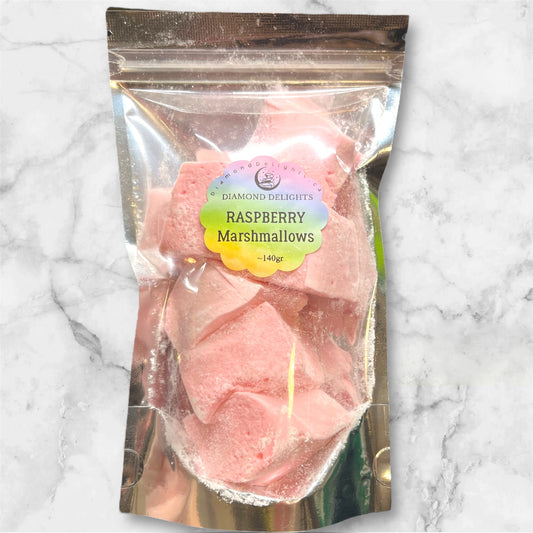 Bag of handcrafted Raspberry Dream Cloud Marshmallows, soft pink cubes dusted with sugar in a clear resealable bag.