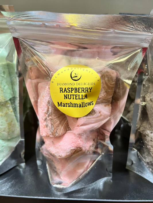 Bag of raspberry marshmallows swirled with Nutella, in a clear resealable pouch with a bright yellow label.