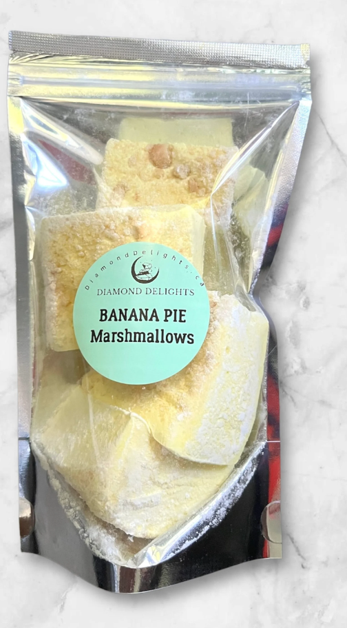 Bag of pale yellow banana pie marshmallows with crushed vanilla crackers, in a clear resealable pouch.
