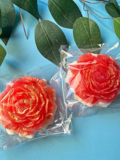 Crystal candy flower shaped like a rose in Fruit Loops and Sweet Milk flavor, wrapped in clear packaging.