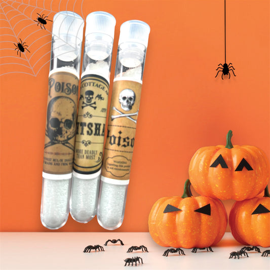 Halloween poison vial candy filled with sour sparkle dip powder, spooky skull and crossbones labels, apothecary style party favor.
