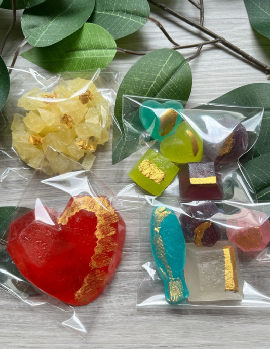 Includes Large Heart, Flower and 2 Assorted Gold Packs. Each candy has gold accents. Assorted flavours and colours.
